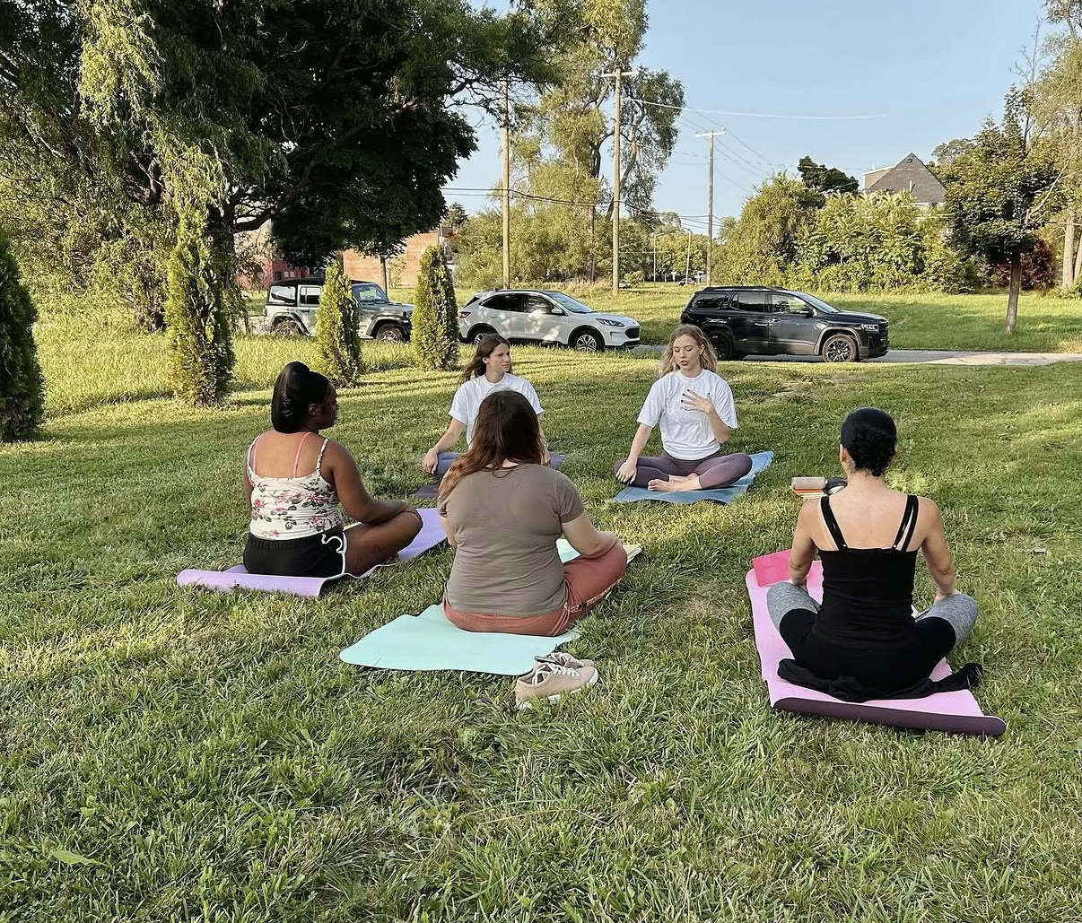 A guided yoga and meditation session on the grass